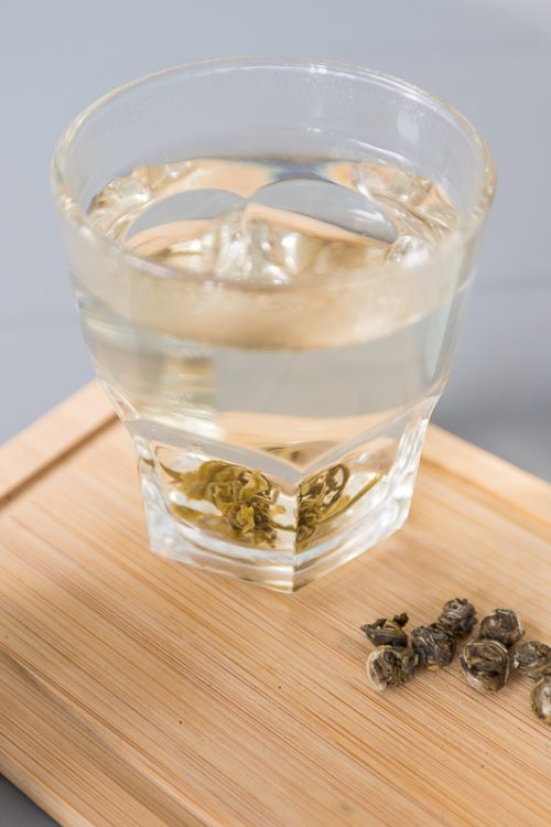 Organic jasmine dragon pearl tea in a resusable tin by Tokki Tea